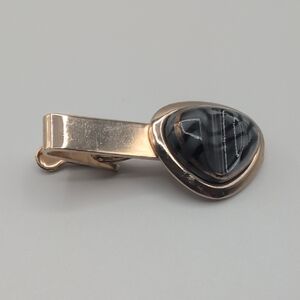 Elegant Black and Gold Toned Tie Clip With Gray And Black Focus